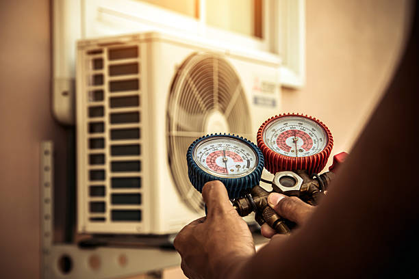 Professional Heat Pump Repair technician working in Bristow, OK